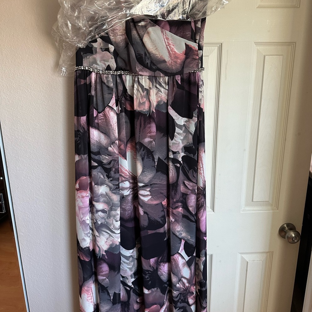 Long dress with a beading detail all around. Size 10 only worn once.